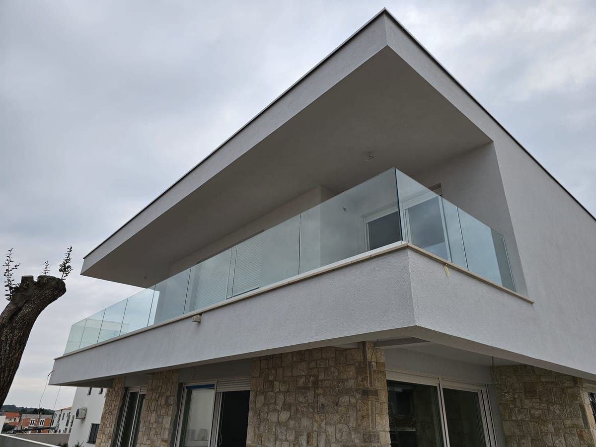 Clear glass railing on a cantilevered balcony